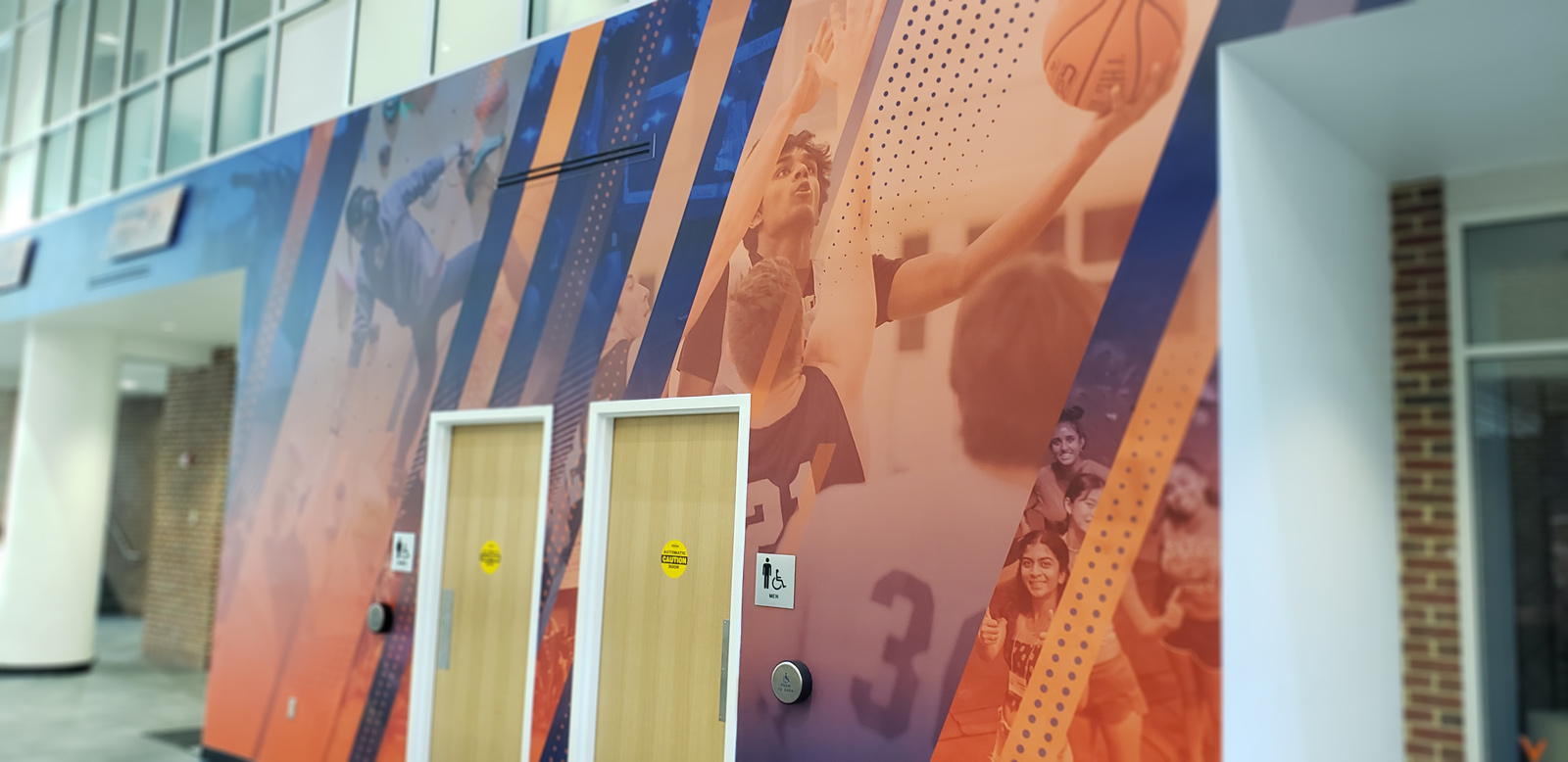The AFC Graphics package completely immersed our largest space in the vibrant energy and passion of UVA Rec.