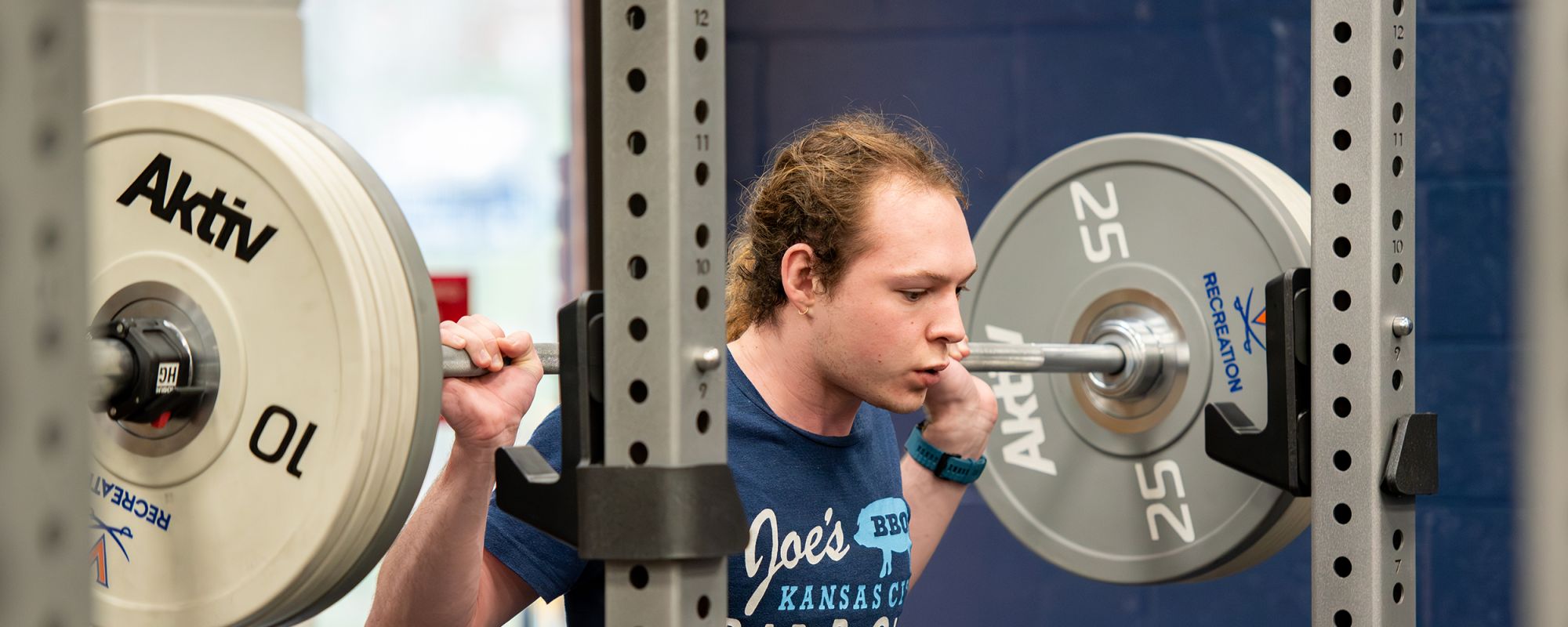 person lifting weights in the weight-room
