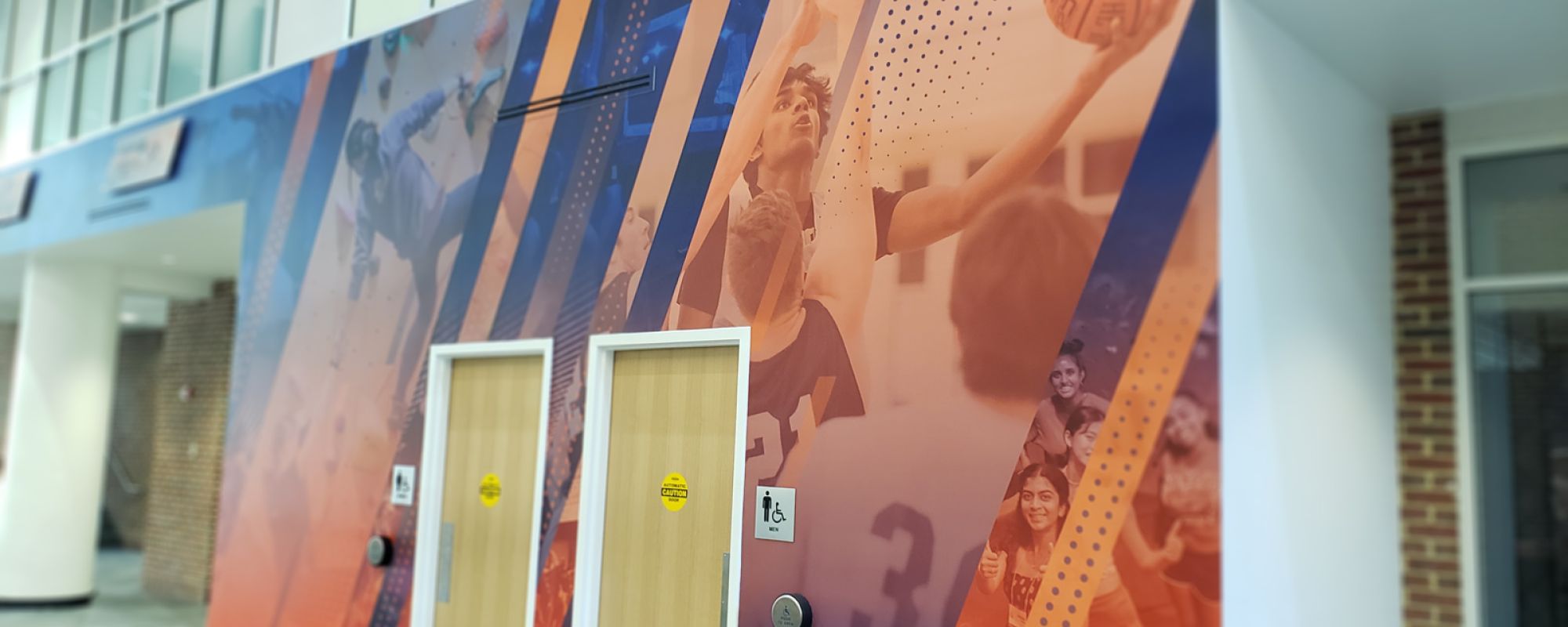The AFC Graphics package completely immersed our largest space in the vibrant energy and passion of UVA Rec.