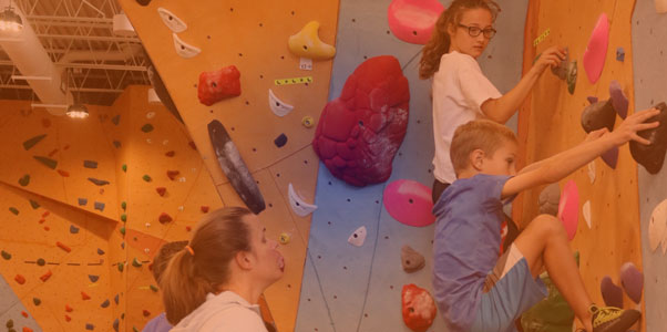 youth on climbing wall